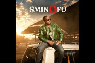 Sminofu in a night‑city setting singing the song Imizamo, captured in the official visualizer frame