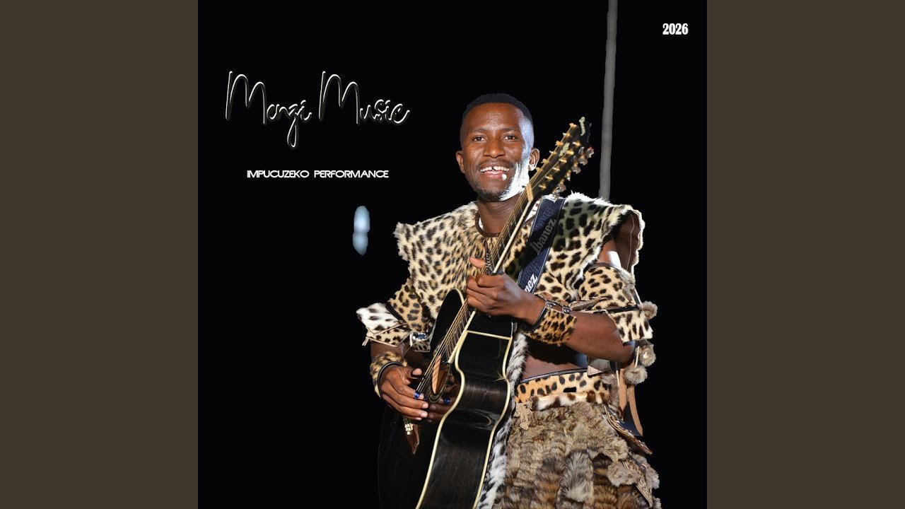 Menzi on stage playing acoustic guitar during the performance mix of Kushoda Obaba & Vuma, with studio lighting and audience in the background
