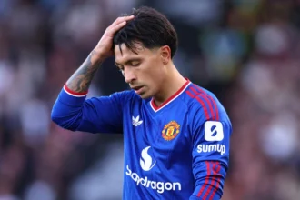 Lisandro Martinez in a Manchester United kit, looking frustrated after the 2-0 defeat to Atletico Madrid in the Champions League.