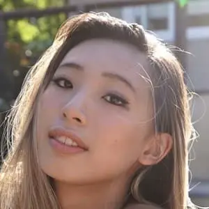 Michelle Chin posing in a chic outfit