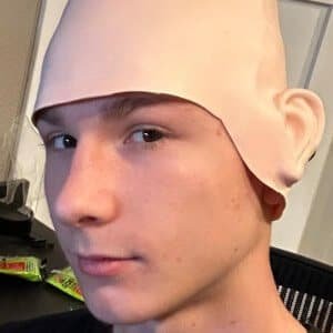 MuffinJuice wearing his cardboard box mask on a bright set