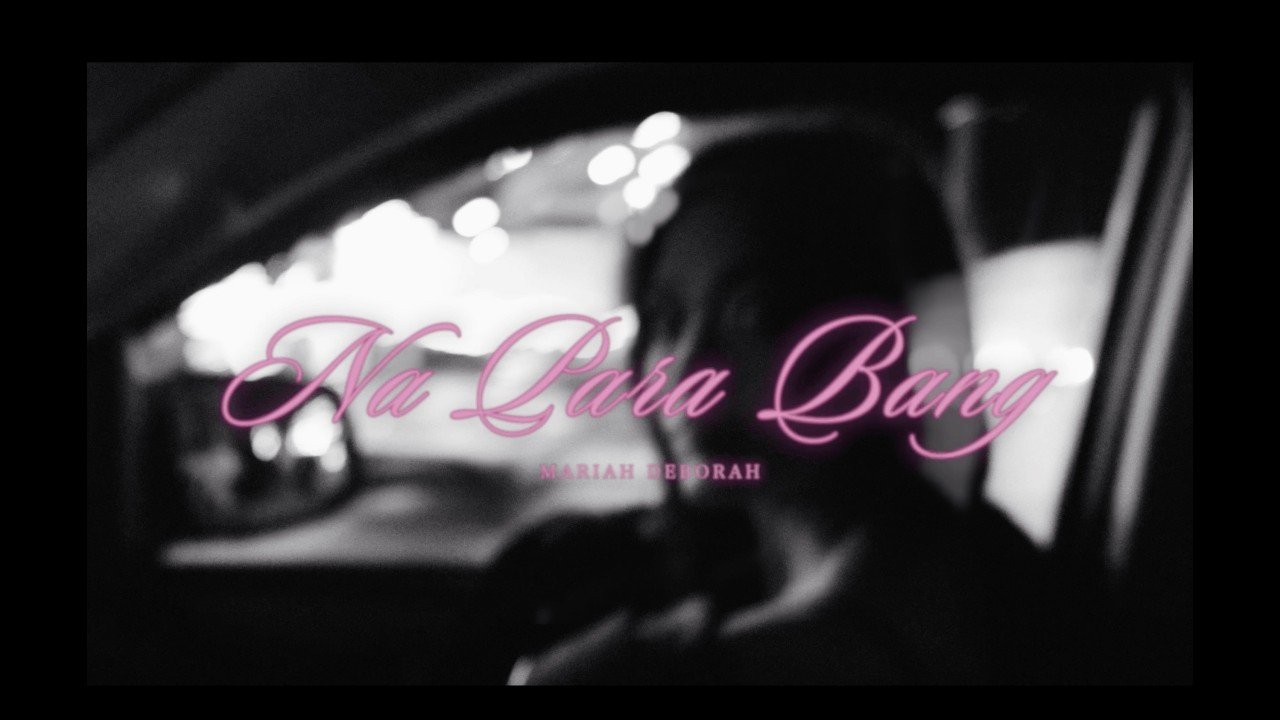 Mariah Deborah singing Na Para Bang in the lyric visualizer video, showing her front profile with text overlay.