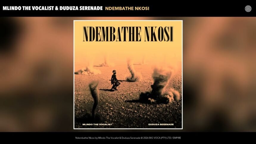 Mlindo The Vocalist and Duduza Serenade standing together on stage while singing their song Ndembathe Nkosi, with a crowd behind them