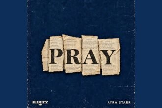 R. City and Ayra Starr on stage singing the song Pray, with bright lights and a live audience