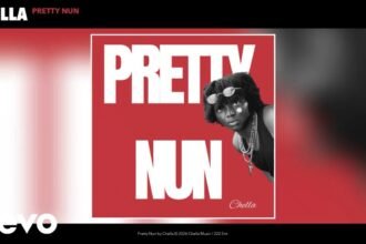Chella singing into a microphone on stage while the title "Pretty Nun" appears on screen behind him