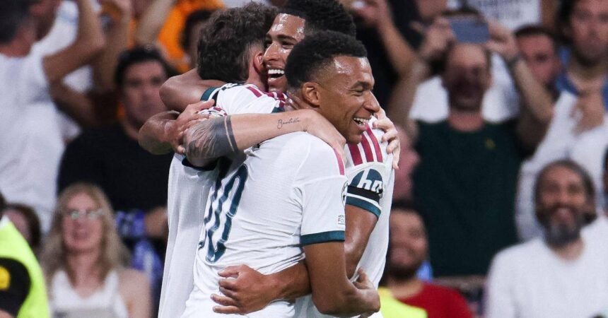 Kylian Mbappe running in celebration during the Barcelona versus Real Madrid match at Camp Nou.