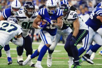 Jonathan Taylor running with the Indianapolis Colts during a 2025 game, wearing his number 28 jersey.