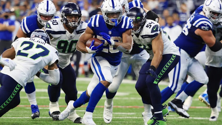 Jonathan Taylor running with the Indianapolis Colts during a 2025 game, wearing his number 28 jersey.