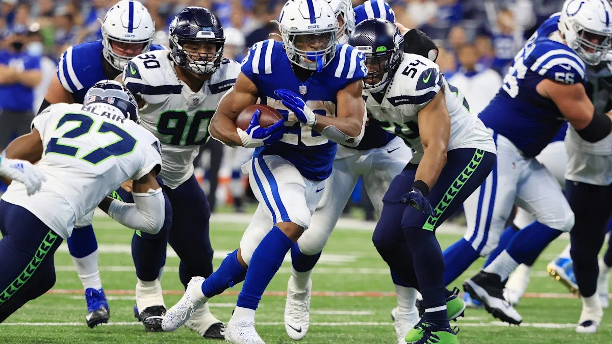 Jonathan Taylor running with the Indianapolis Colts during a 2025 game, wearing his number 28 jersey.