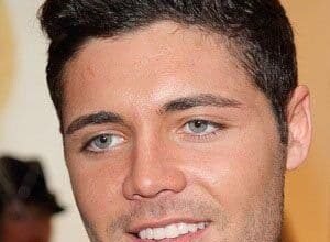 Tom Pearce, 36-year-old English reality TV star, smiling at a public event