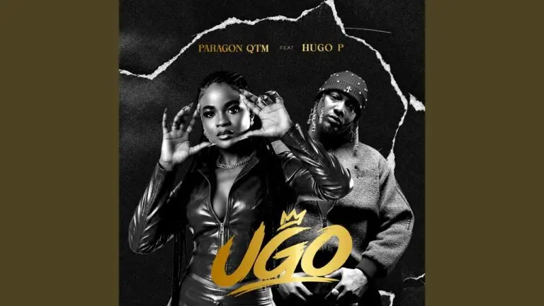 Paragon Qtm and Hugo P on stage during a live performance of the song Ugo, with bright stage lighting and audience in the background.