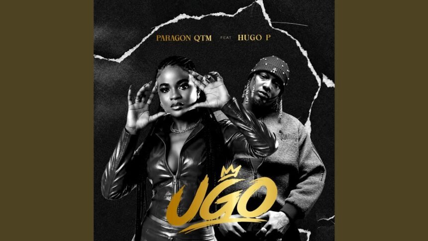 Paragon Qtm and Hugo P on stage during a live performance of the song Ugo, with bright stage lighting and audience in the background.