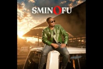 Sminofu on stage singing Umalumekazi with Njabulo Langa, colorful lights in the background